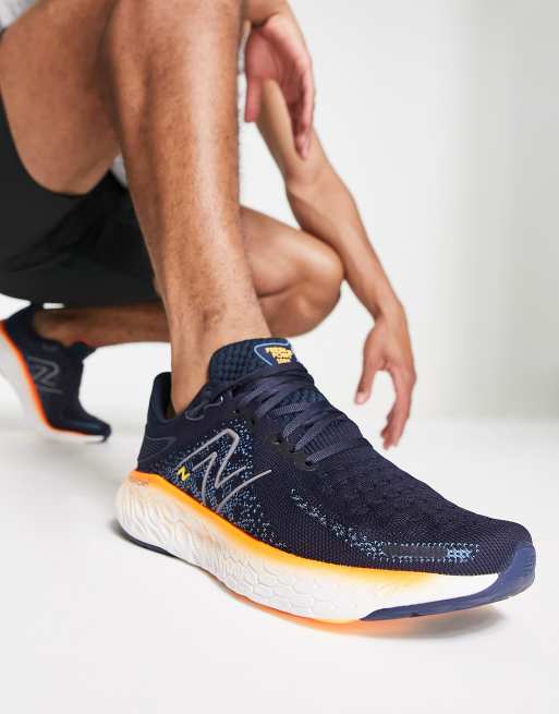 New Balance Running Fresh Foam X 1080v12 trainers in navy and orange