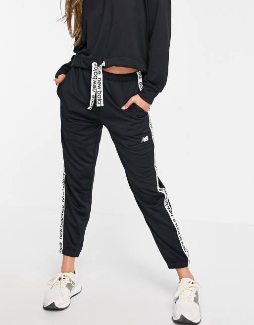 New Balance Running joggers with logo taping in black, ASOS