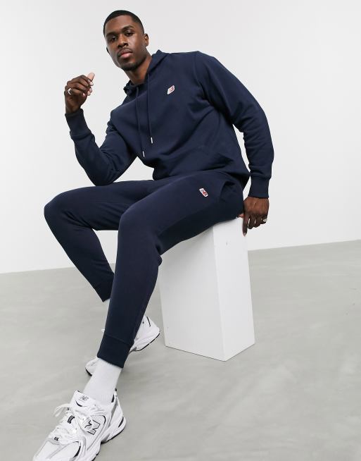 New Balance small logo joggers in navy ASOS