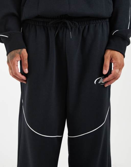 New Balance spodnie dresowe z french terry, czarne, 4 z 5