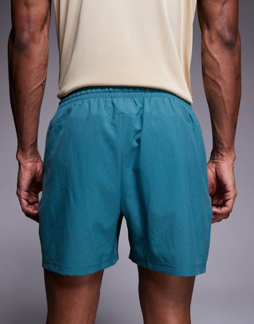 New Balance - Sport Essentials - 5 inch short in groenblauw, 5 van 5