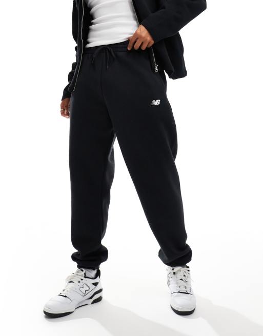 New Balance sport essentials fleece joggers in black - BLACK | ASOS