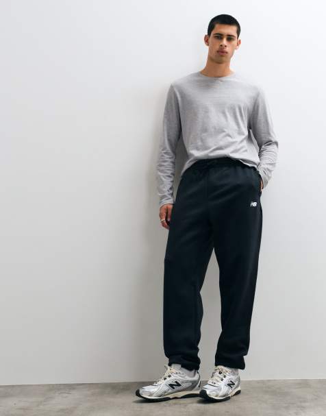 New Balance sport essentials fleece trackies in black - view 1