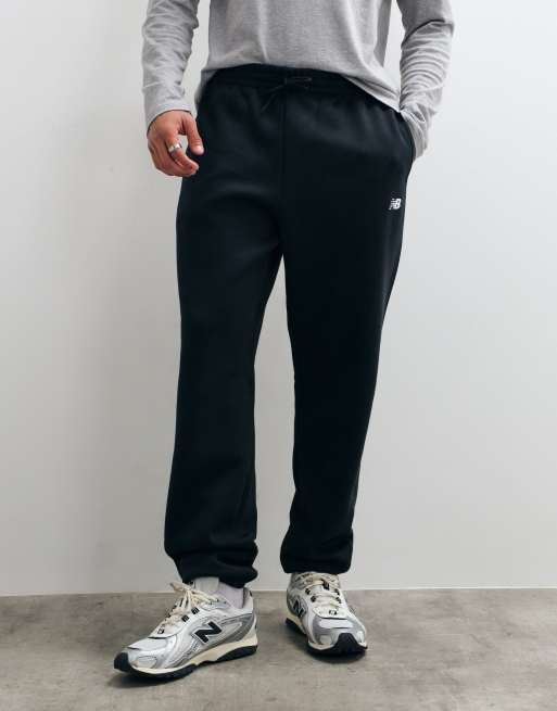 New Balance sport essentials fleece trackies in black, 2 of 5