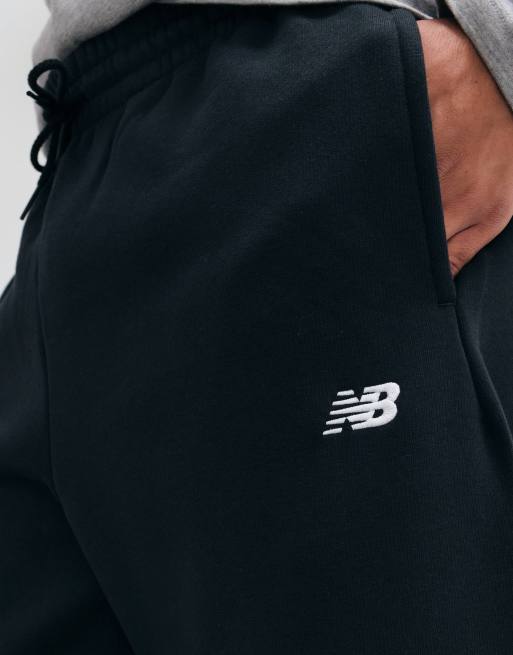 New Balance sport essentials fleece trackies in black, 4 of 5