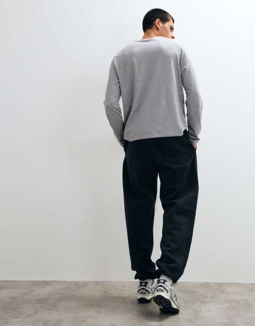 New Balance sport essentials fleece trackies in black, 5 of 5