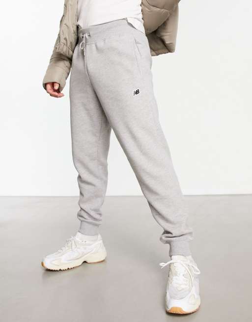 New Balance – Szare joggersy z małym logo