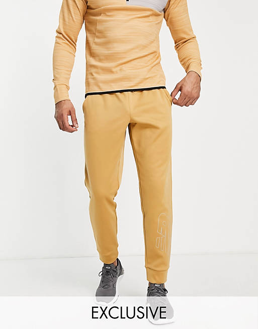 New Balance Tenacity trackies with logo in sand Exclusive to ASOS