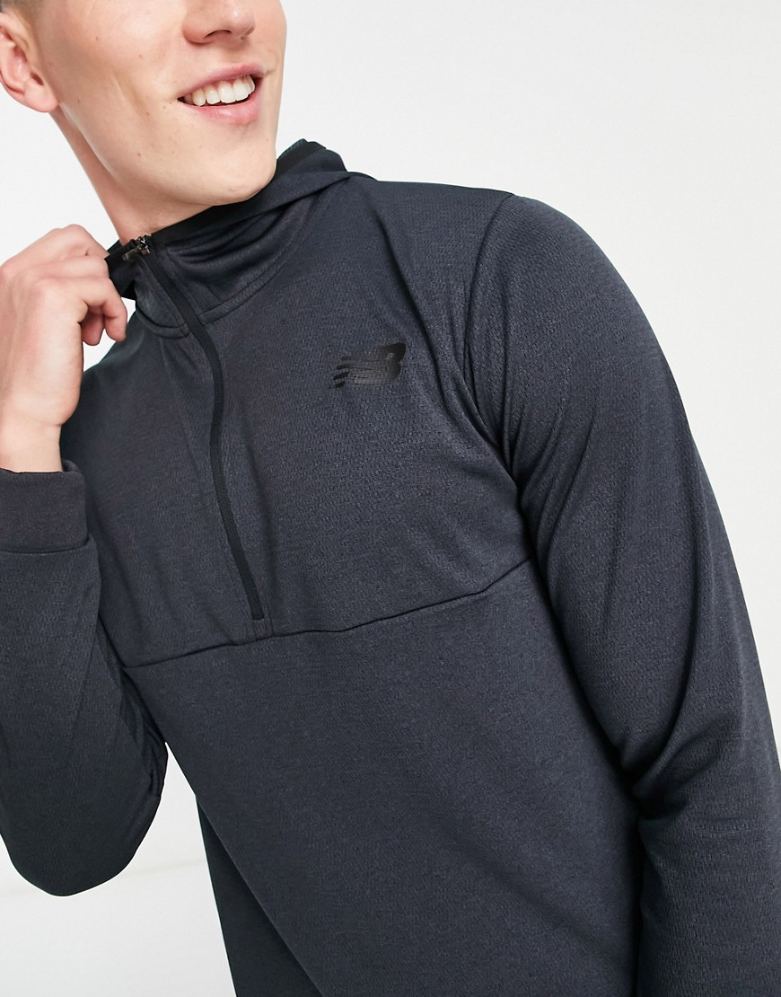 New Balance Tenacity training hooded 1/4 zip long sleeve top in black