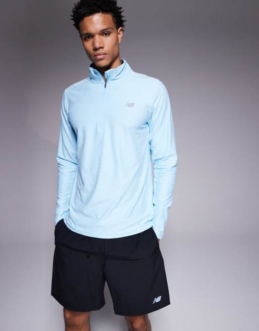 New Balance - Top azzurro con zip corta 