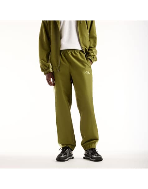 New Balance - Trackside - Broek van geweven stof in sportgroen - view 1