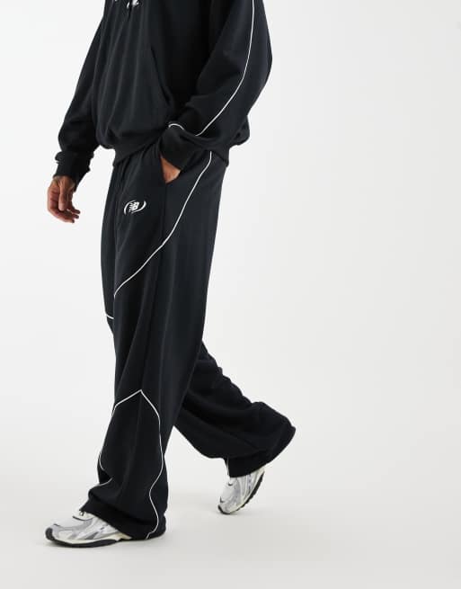 New Balance trackside french terry track pants in black, 3 of 5