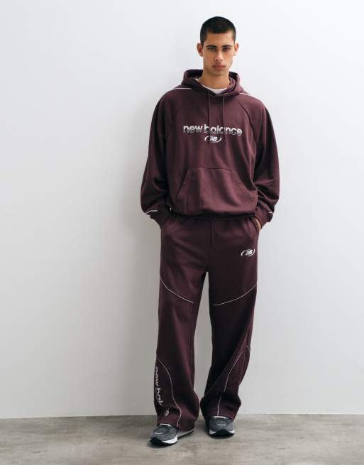 New Balance Trackside Kapuzenpullover aus French Terry in Kirschrot, 3 von 5