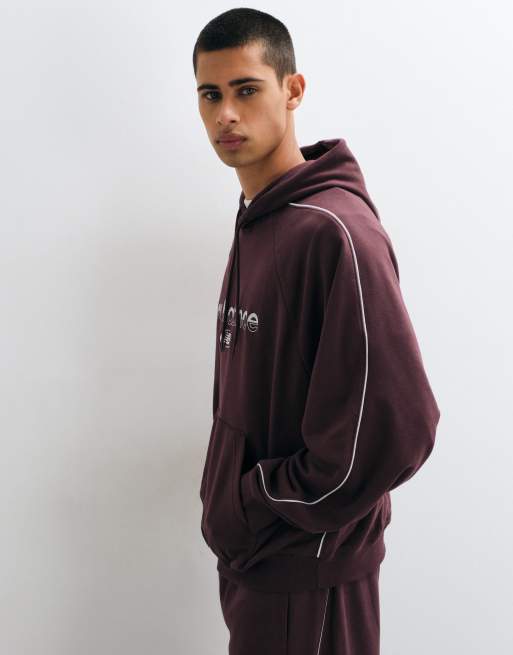 New Balance Trackside Kapuzenpullover aus French Terry in Kirschrot, 5 von 5