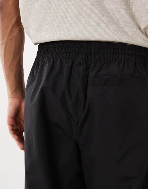 New Balance Trackside woven pant in black, 4 of 5