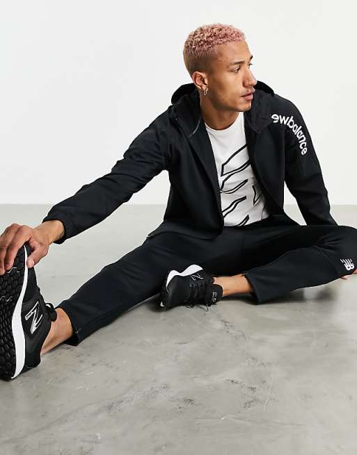 New Balance Training tenacity woven hooded jacket in black New Balance Training tenacity woven hooded jacket in black
