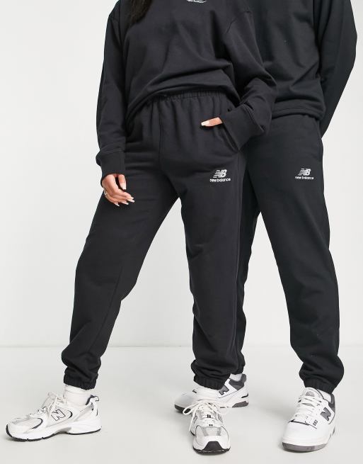 New Balance Unisex logo joggers in black | ASOS