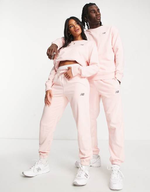 New Balance Unisex logo joggers in pink ASOS