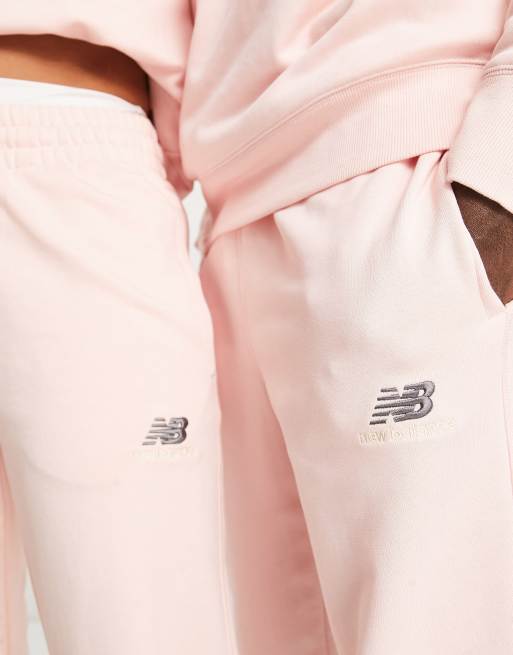 New Balance Unisex logo sweatpants in pink - part of a set