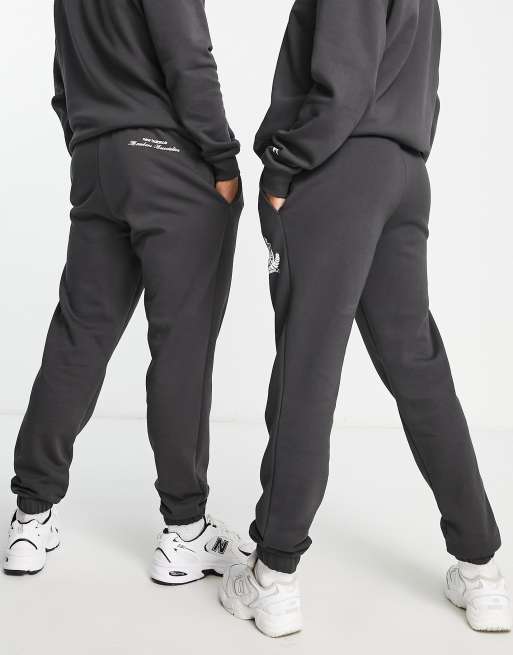 New Balance Running joggers with logo taping in black, ASOS