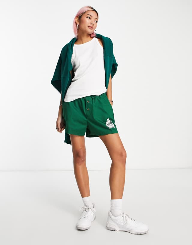 New Balance Unisex Members Club varsity jacket in dark green and white