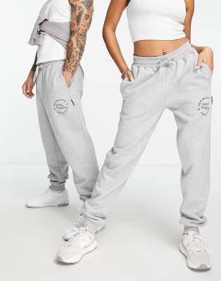 New Balance New Balance Unisex runners club joggers in grey - Exclusive to ASOS