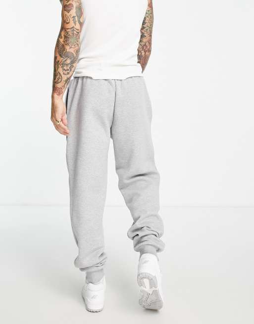 New Balance Unisex runners club sweatpants in gray - Exclusive to