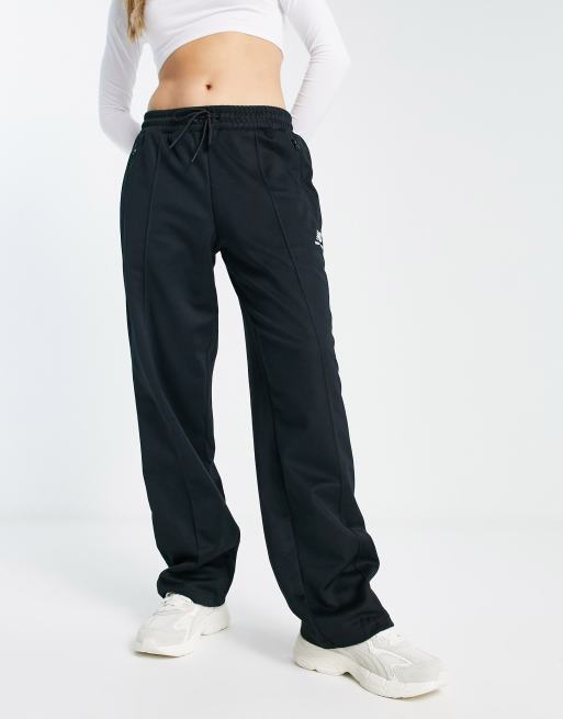 New Balance unisex track pants in black | ASOS