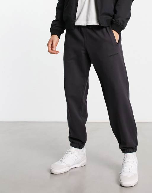 New Balance washed joggers with logo in washed grey | ASOS