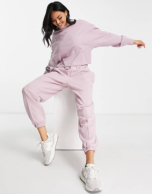 New Balance washed trackies with logo in lilac | ASOS