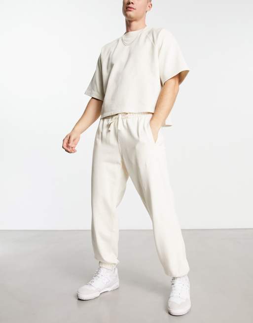 New Balance washed trackies with logo in off white