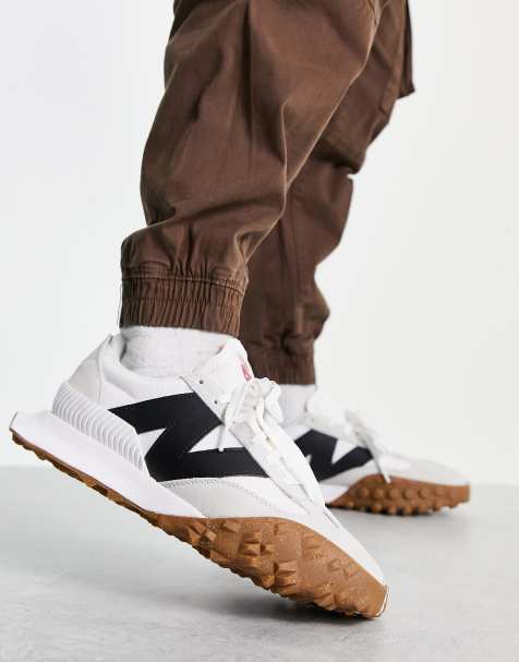 New Balance XC72 trainers in light grey and black - view 1