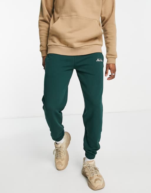 New Era heritage essentials joggers in green exclusive to ASOS