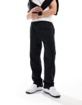 [New Era] New Era wide leg logo trackies in black XL Black