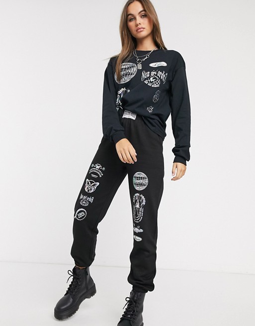 New Girl Order relaxed joggers with reflective graphics co-ord