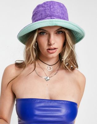 New Girl Order reversible bucket hat in purple and mint towelling