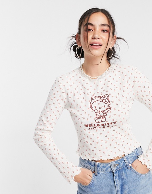 New Girl Order x Hello Kitty – Prążkowany top z długim rękawem, koronką przy szyi i kwiatowym wzorem FKUP