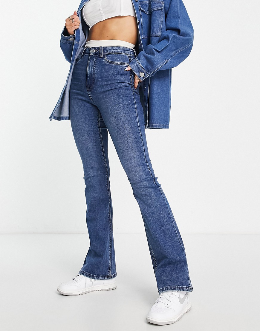 New Look bootcut flared high rise jeans in mid blue wash