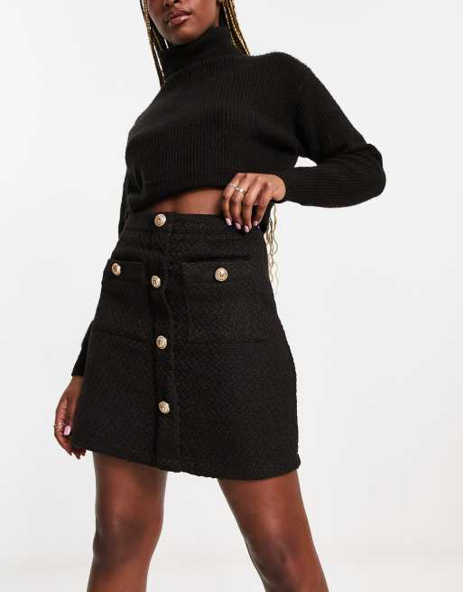 Black mini shop button skirt