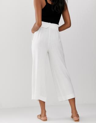 white cut off trousers