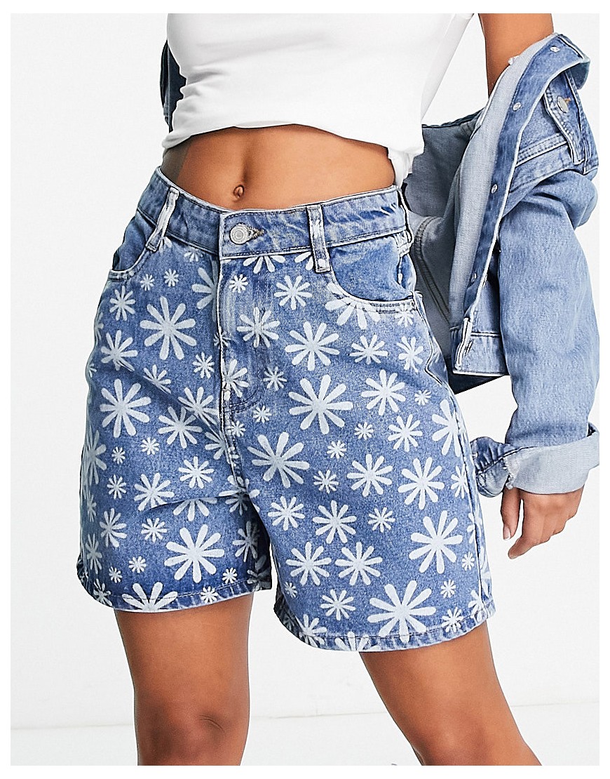 New Look daisy graffiti print denim shorts in mid blue