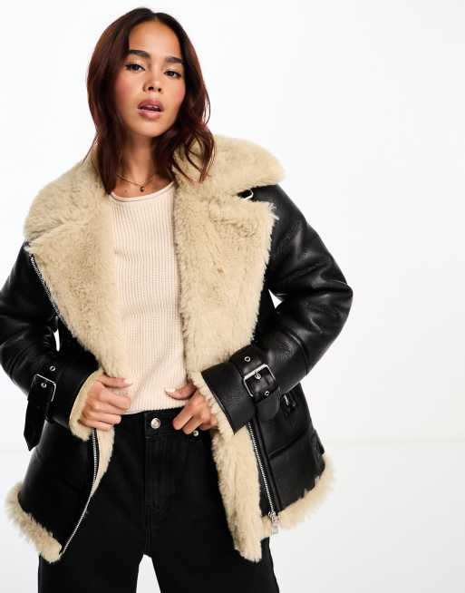 New Look faux fur aviator in black and tan | ASOS