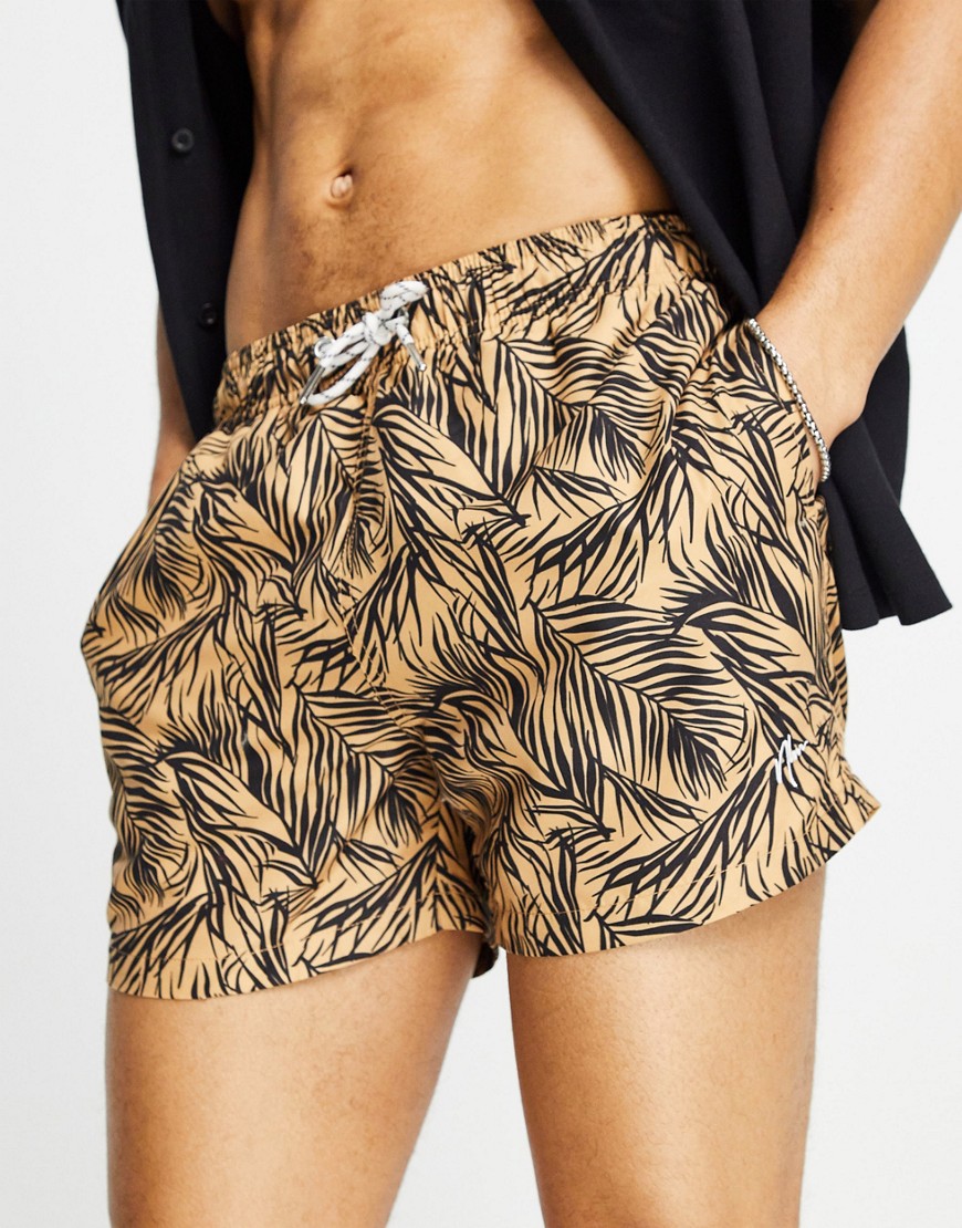 New Look floral print shorter length swim shorts in burnt orange