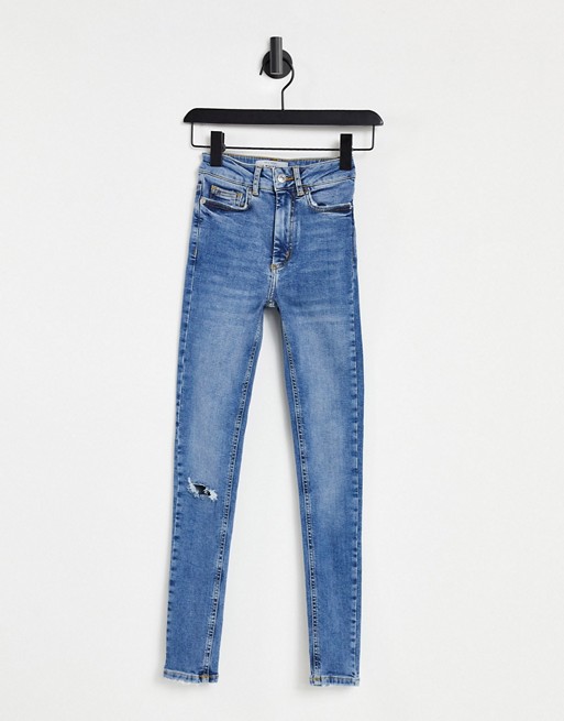 New Look fray hem ripped mid rise jean in blue