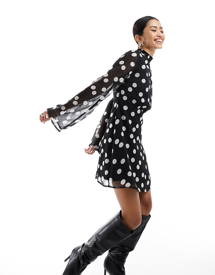 New Look high neck flutter sleeve mini dress in polka dot-Black