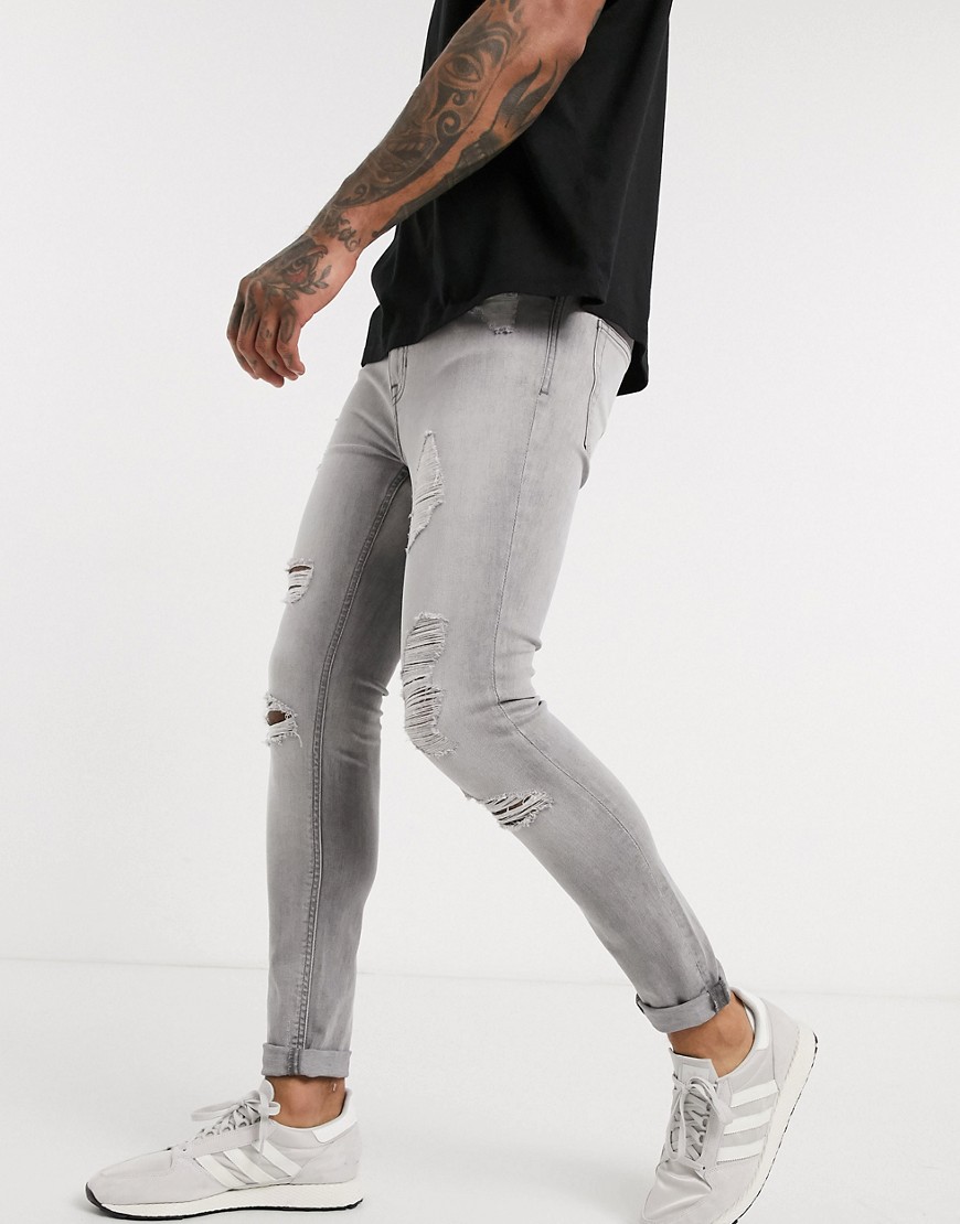 New Look - Jeans strappati effetto spray grigi-Grigio
