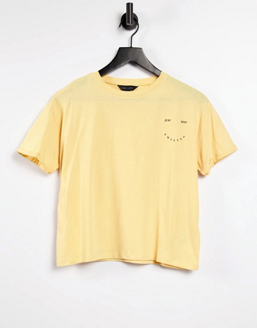 New Look just keep smiling slogan t-shirt in light yellow