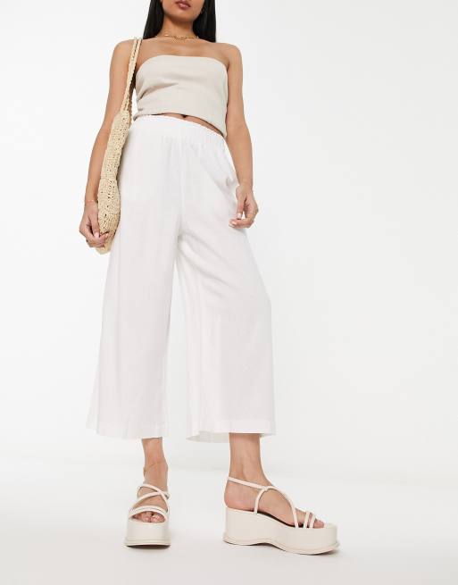 White linen cropped store trousers