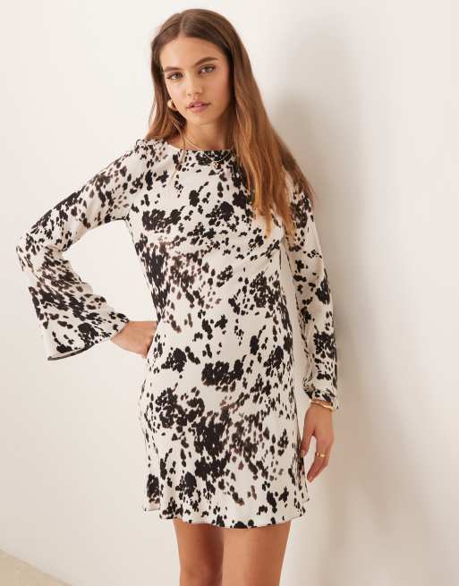 New Look long sleeve mini dress in cow print