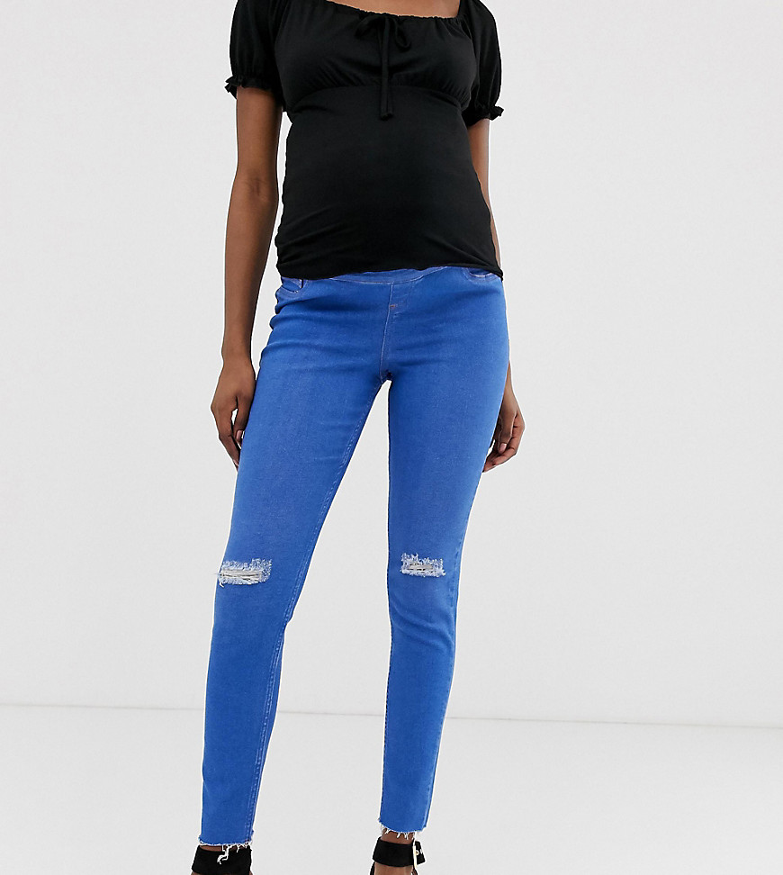 New Look Maternity - Over de buk vallende ripped jeans in blauw
